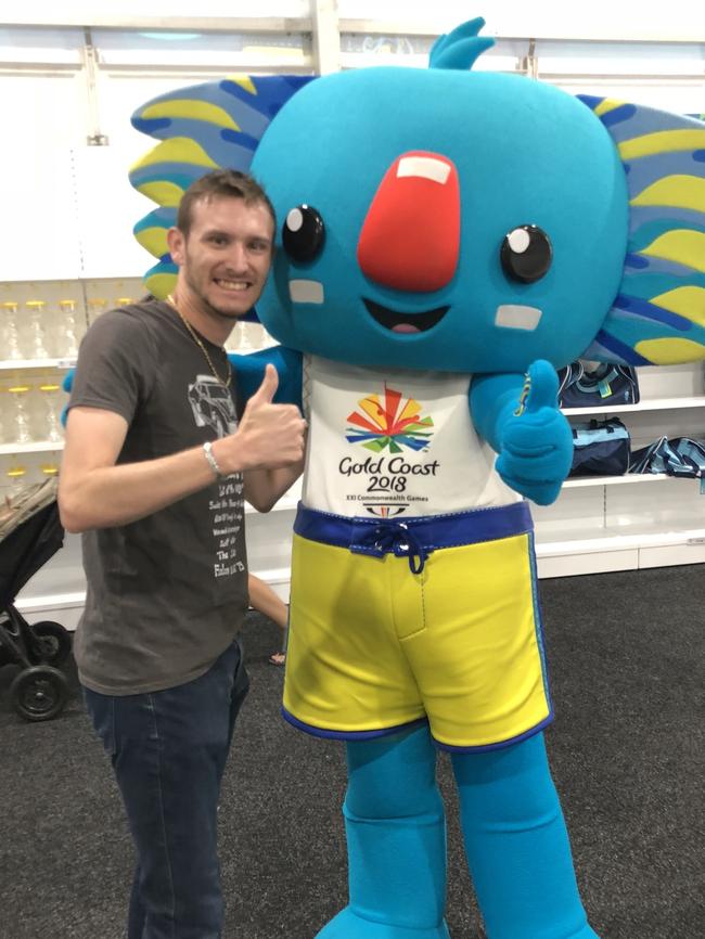 Gold Coast Bulletin journalist Andrew Potts with Borobi while covering the 2018 Commonwealth Games.