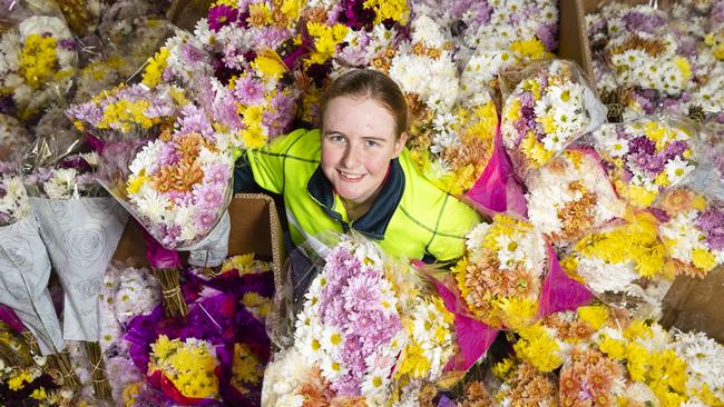 Madison Holdsworth with flowers for the Endeavour Foundations Mother's Day flower sale, Thursday, May 11, 2023. Picture: Kevin Farmer