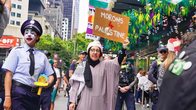 Protesters calling themselves ‘Morons 4 Palestine’ have gatecrashed the famous Myer Christmas windows on Bourke St. Picture: NewsWire / Luis Enrique Ascui