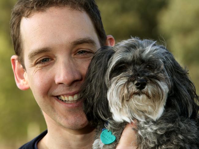 New Oakleigh Labor MP Steve Dimopoulos gets cosy with rescue dog Zoe.