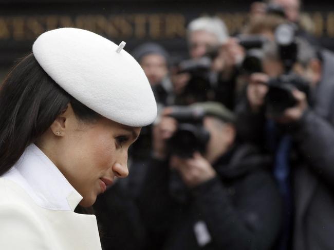 (FILE PIC)  Photographers focus on US actress Meghan Markle, fiancee of Britain's Prince Harry as she leaves a Commonwealth Day Service at Westminster Abbey in central London, on March 12, 2018. - Britain's Queen Elizabeth II has been the Head of the Commonwealth throughout her reign. Organised by the Royal Commonwealth Society, the Service is the largest annual inter-faith gathering in the United Kingdom. (Photo by KIRSTY WIGGLESWORTH / POOL / AFP)