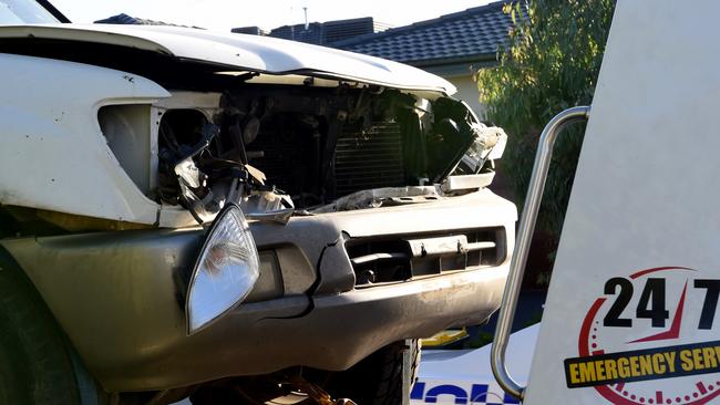 Cars damaged in the street are towed away. Picture: Nicole Garmston