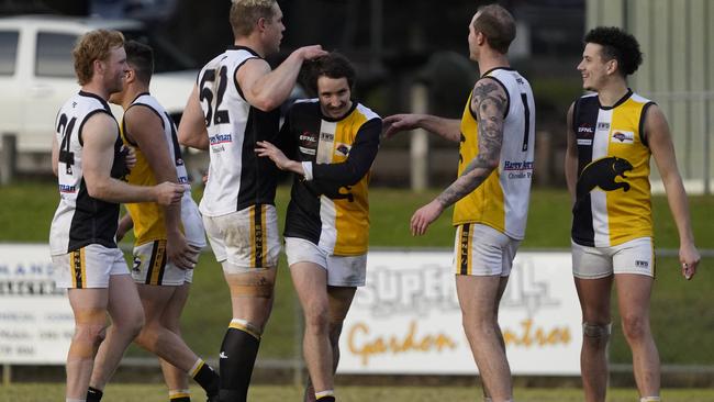 Chirnside Park players get around Sam King (middle) who bagged seven majors on Saturday. Picture: Valeriu Campan