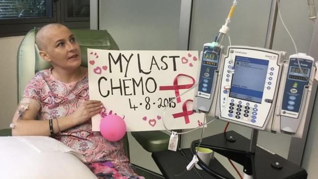 Breast cancer survivor, Katie Henderson, recalls being almost halfway through chemo when her body wasn’t coping with the strength of the chemotherapy medicine. She marked her last day of chemotherapy with a poster and support of her family. Picture: Katie Henderson.