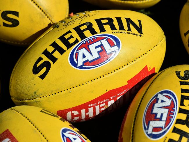 Australian Rules footballs are seen at Arden Street in Melbourne, Thursday, Sept. 10, 2015. (AAP Image/Julian Smith) NO ARCHIVING