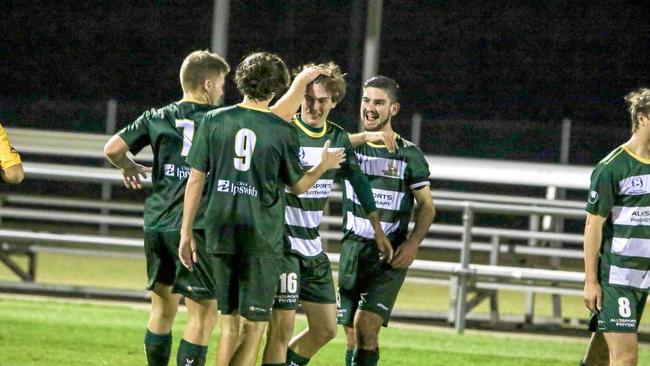 Western Pride goal scorer Alex Parsons is congratulated by his teammates after another football victory. Picture: Carl Groenewald