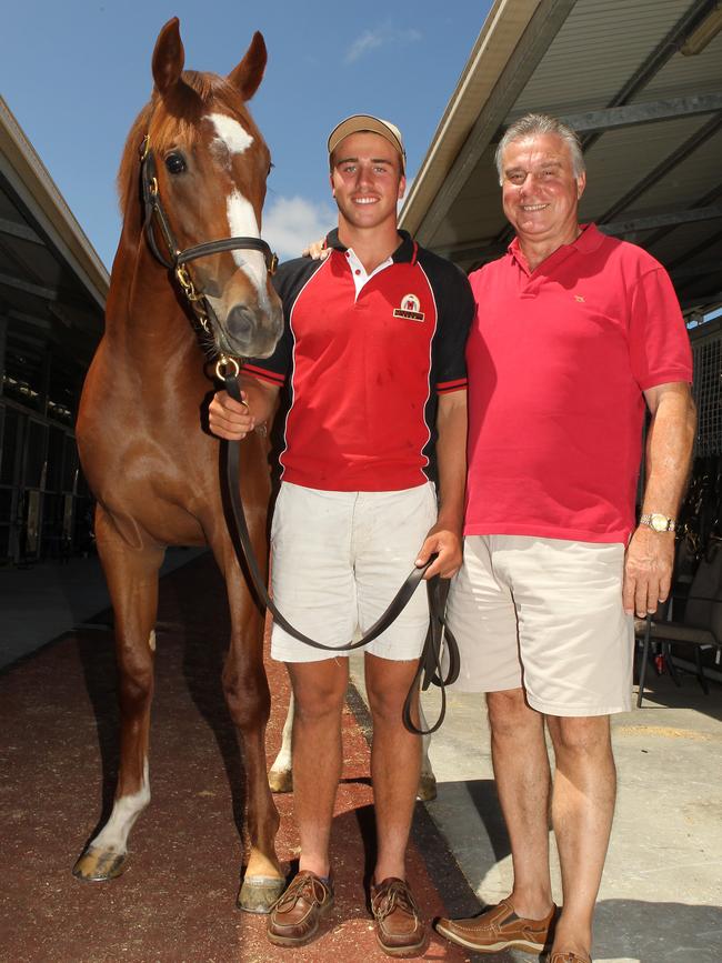 Hamish with his horse trainer father Neville Stewart. Picture: Scott Fletcher