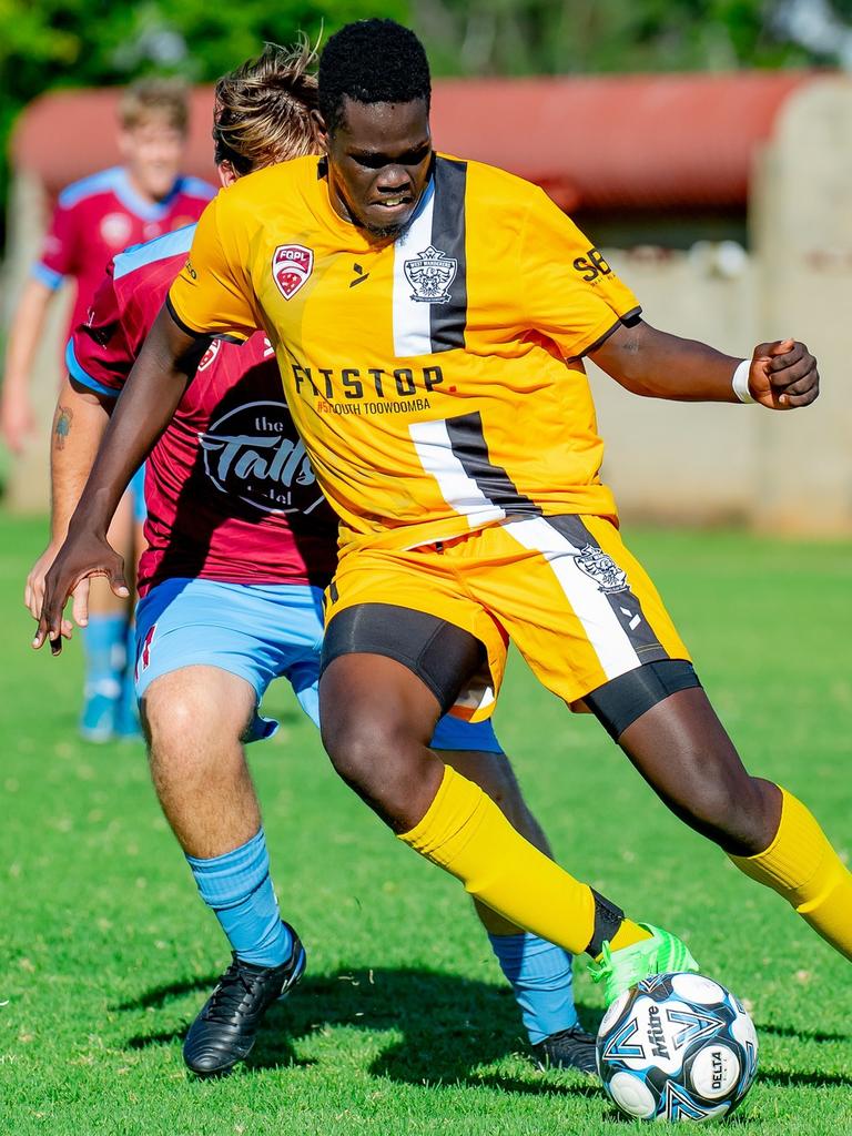 Current FQPL Darling Downs men's Golden Boot leader Jok Ayii of West Wanderers FC takes on the St Albans defence. Picture: DSL Photography