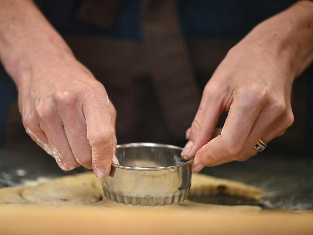 Catherine, Princess of Wales cuts out Welsh Cakes, at the The Welsh Cake Shop, during a visit to Pontypridd Market. Picture: AFP