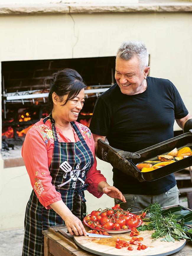 Jane and Jimmy Barnes whipping up a meal in their country kitchen. Photo: Alan Benson.