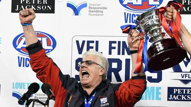 Gary Ayres is exultant as he lifts the 2017 VFL premiership cup.