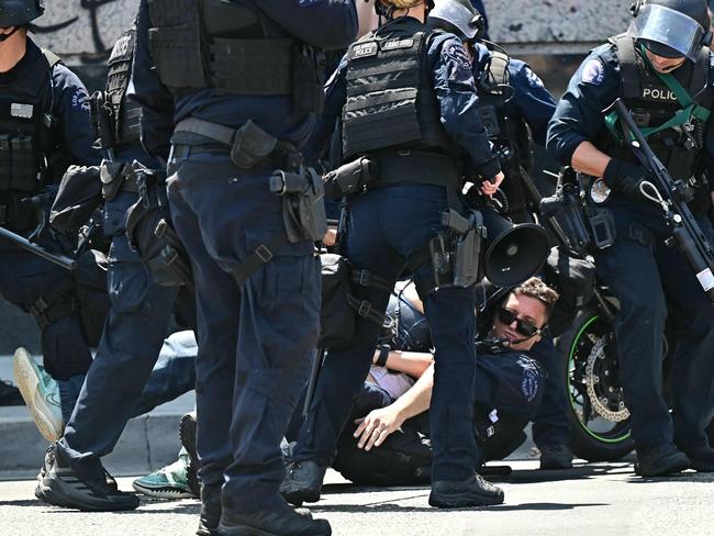 Dozens of people have been arrested as cops clashed with demonstrators outside the Metropolitan Detention Center, MDC, in downtown Los Angeles, California. Picture: AFP