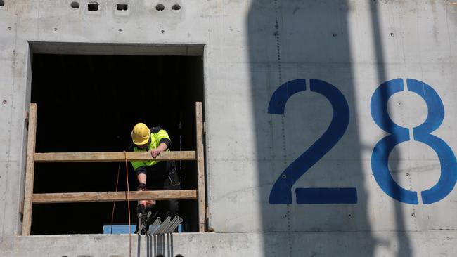 One of the 180 workers on the Skyhaus goes about his day on the 28th floor.