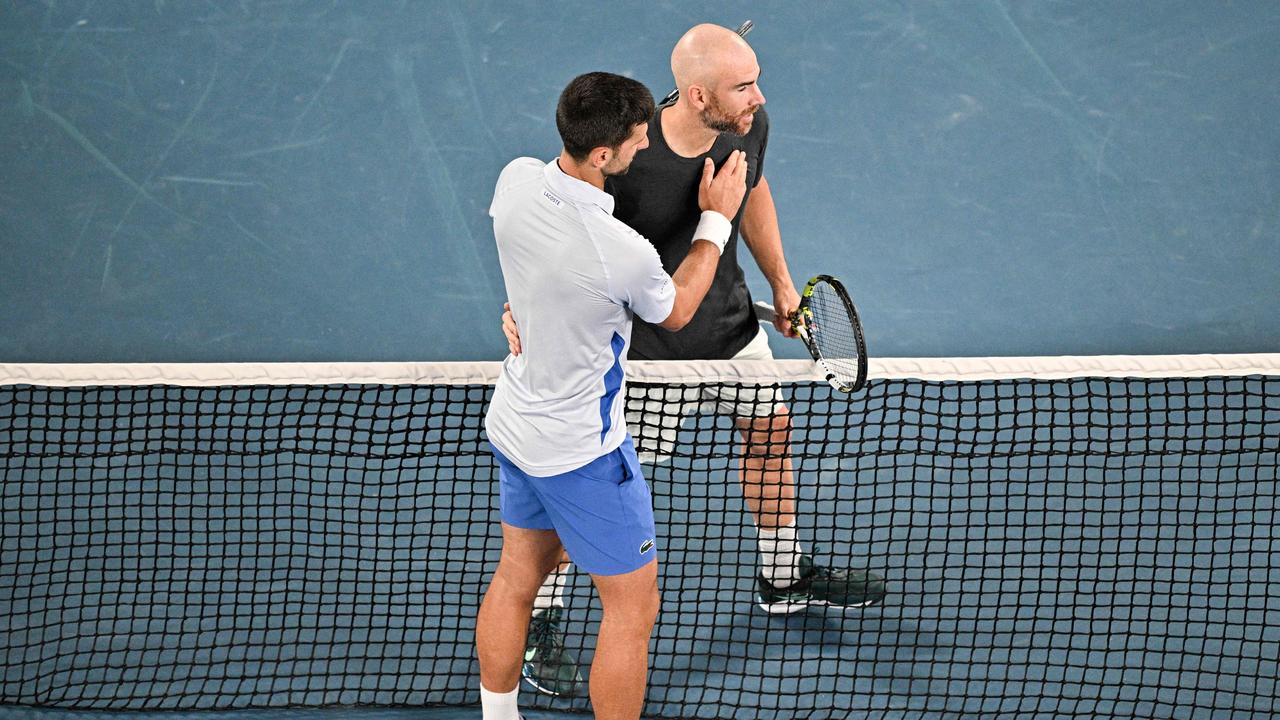 Serbia's Novak Djokovic shakes hands with France's Adrian Mannarino after their men's singles match on day eight of the Australian Open tennis tournament in Melbourne on January 21, 2024. Picture: AFP