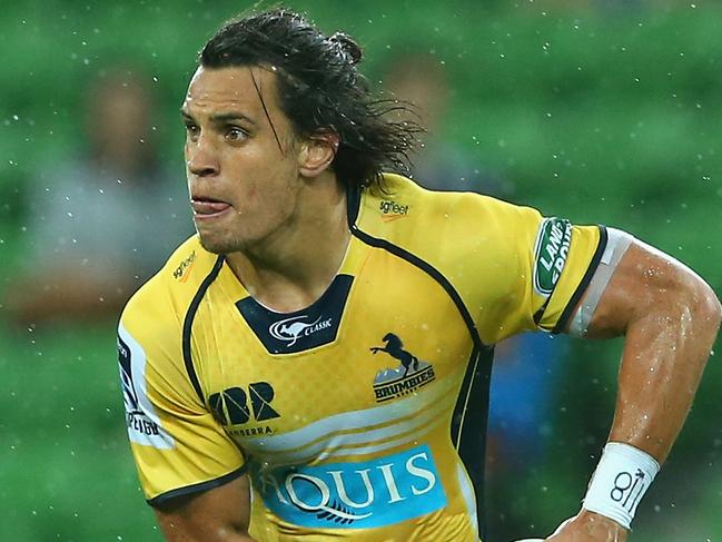 MELBOURNE, AUSTRALIA - FEBRUARY 28: Matt Toomua of the Brumbies passes the ball whilst being tackled during the round three Super Rugby match between the Rebels and the Brumbies at AAMI Park on February 28, 2015 in Melbourne, Australia. (Photo by Quinn Rooney/Getty Images)