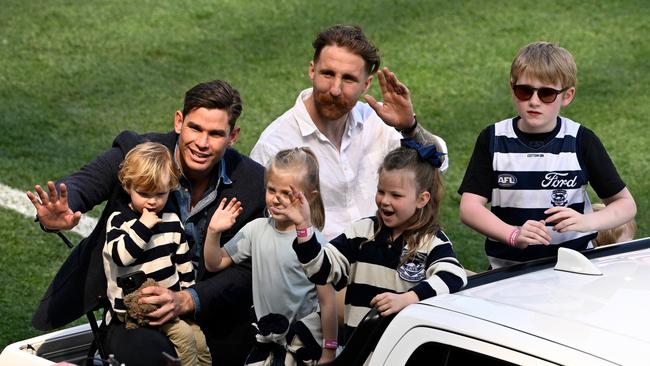 Retirees Tom Hawkins and Zach Tuohy of the Cats ride in the retiring players motorcade with their kids during the 2024 AFL grand final. (Photo by Adam Trafford/AFL Photos via Getty Images)