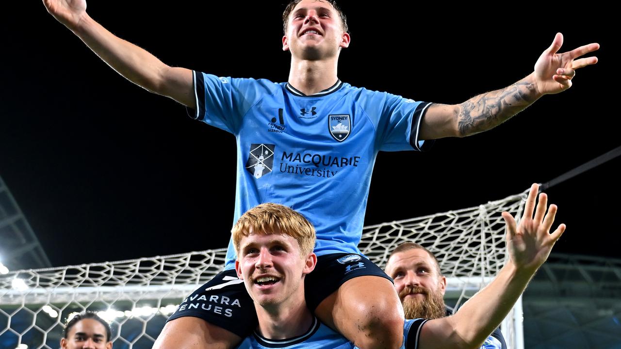 Adrian Segecic and Jaiden Kucharski lead Sydney FC’s celebrations after victory over the Mariners. Photo: Albert Perez/Getty Images.