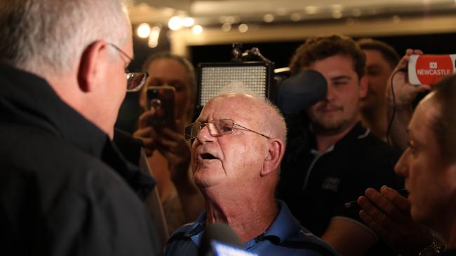 A man confronts Scott Morrison at a Newcastle hotel. Picture: Damian Shaw