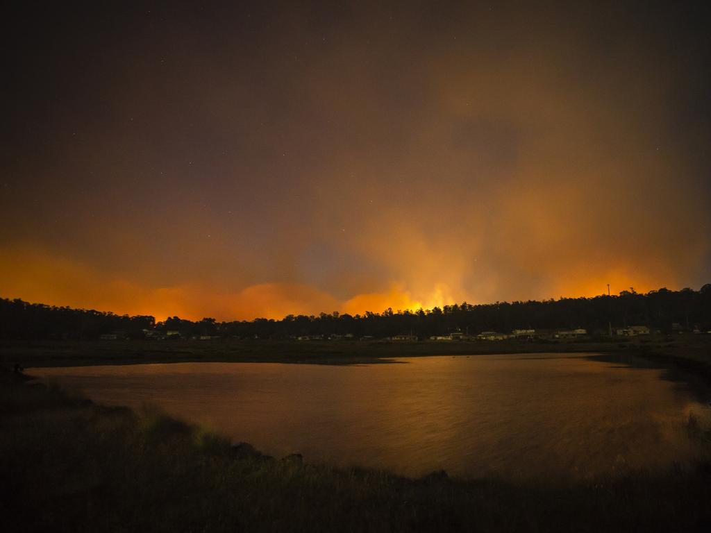 Smoke billows behind the Great Lake pub. Picture: Heath Holden/Getty