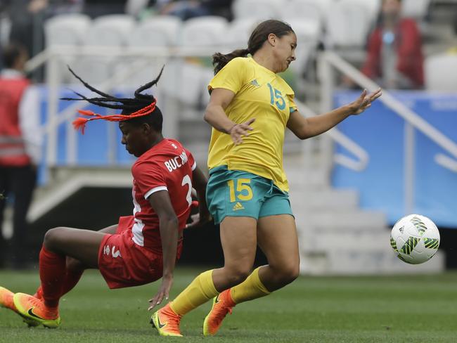 Canada's Kadeisha Buchanan, left, fight for the ball with Australia's Sam Kerr.