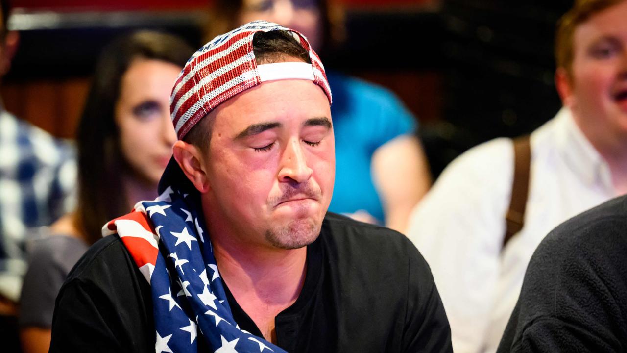 A patron reacts during a watch party for the first presidential debate. Picture: Josh Edelson / AFP