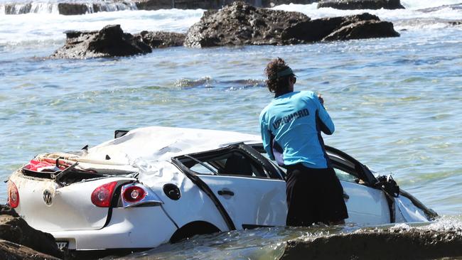 The scene at Bar Beach, Newcastle, where a car plunged of a car park lookout into the sea. Picture by Peter Lorimer.