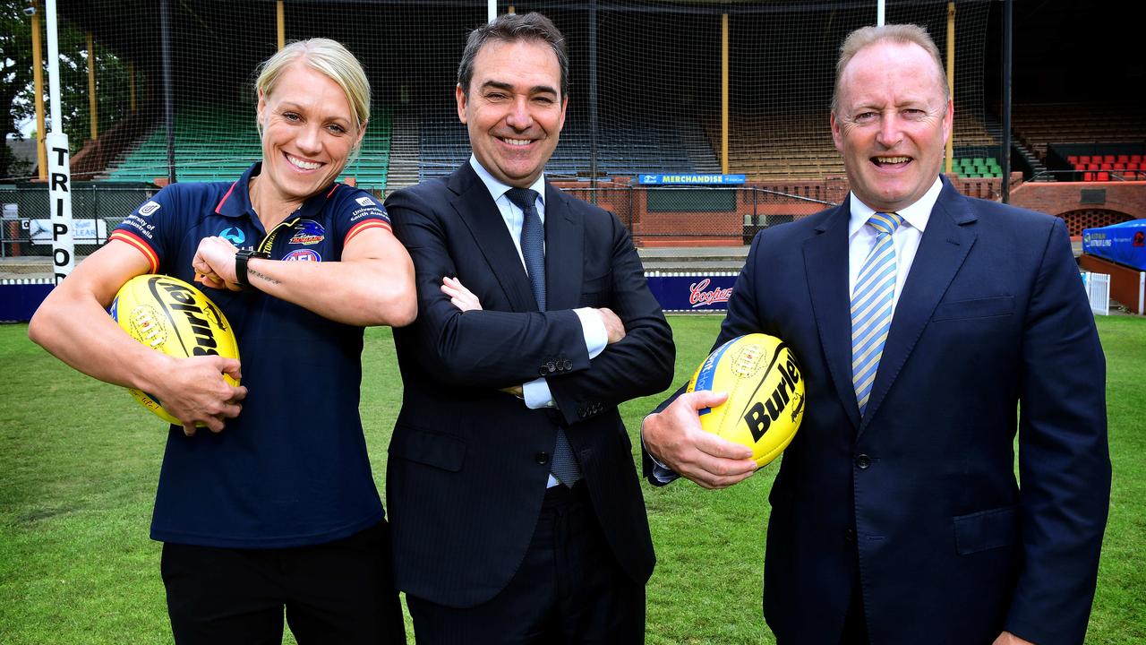 Erin Phillips, Premier Steven Marshall and Adelaide Crows Chairman Rob Chapman pose for a photo after the State Government announced its continued funding of the Adelaide Crows AFLW team at the Parade Oval. Picture: Image AAP/Mark Brake