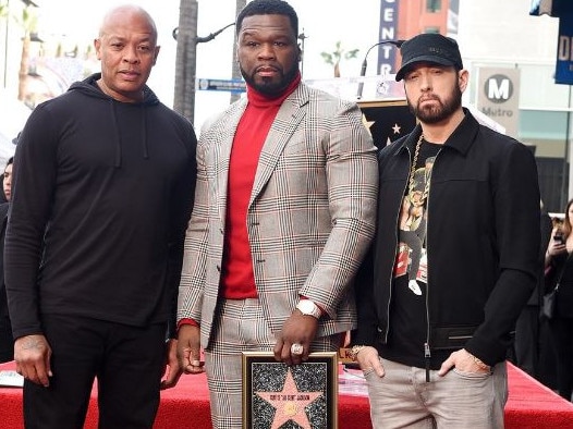 Dr Dre, 50 Cent and Eminem pictured in January when the rapper received a star on the Hollywood Walk of Fame. Picture: Getty Images