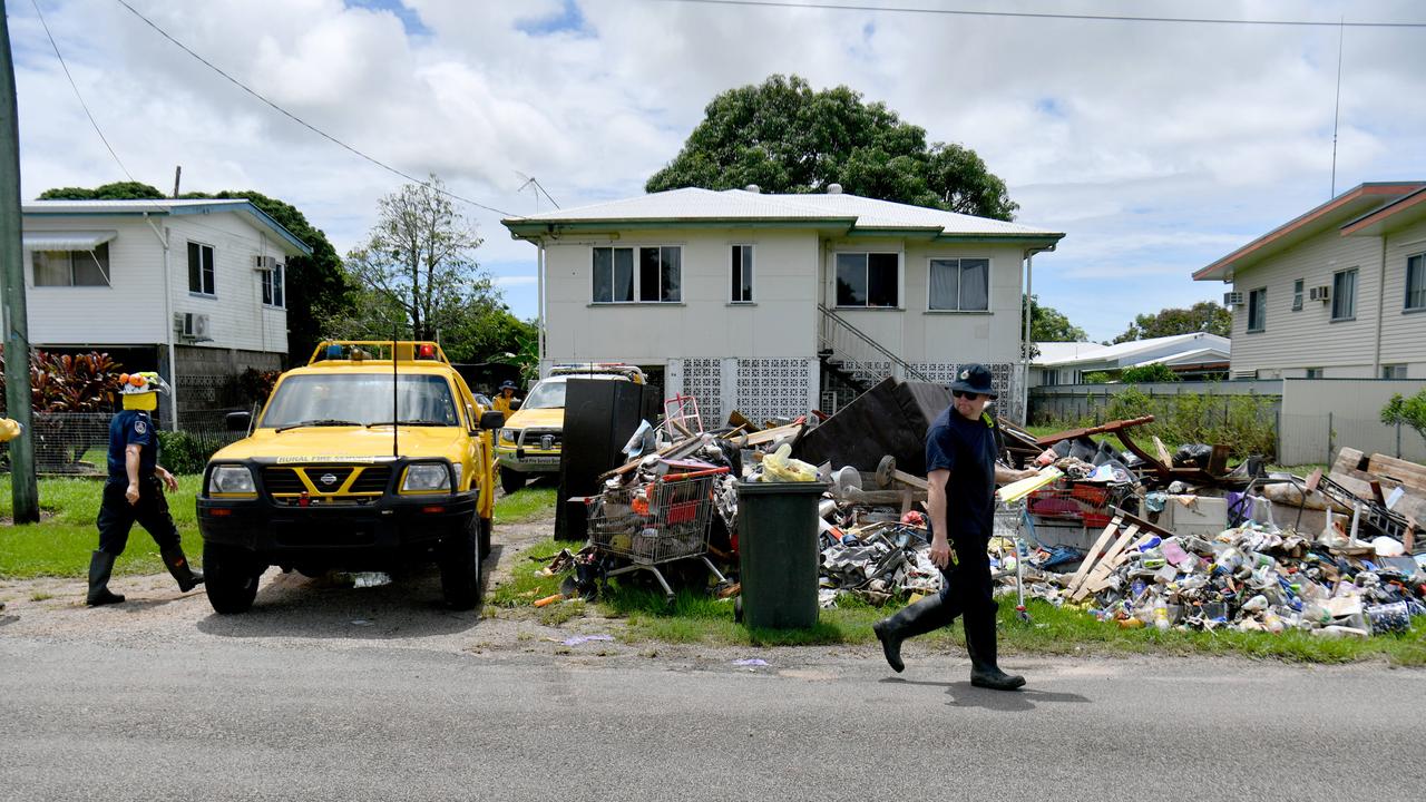 Clean up after flooding in Ingham. Rural firefighters from southern Queensland, SA and NSW help clean up. Davidson Street. Picture: Evan Morgan