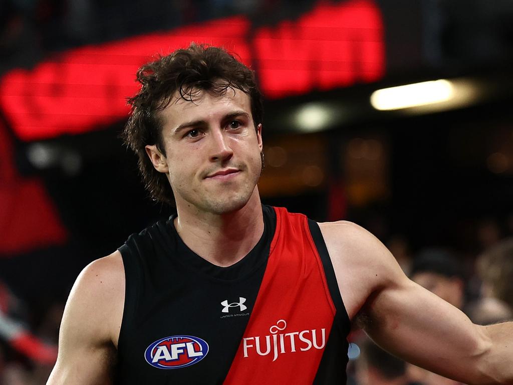 MELBOURNE, AUSTRALIA – MARCH 30: Andrew McGrath of the Bombers high fives fans after winning the round three AFL match between Essendon Bombers and St Kilda Saints at Marvel Stadium, on March 30, 2024, in Melbourne, Australia. (Photo by Quinn Rooney/Getty Images)