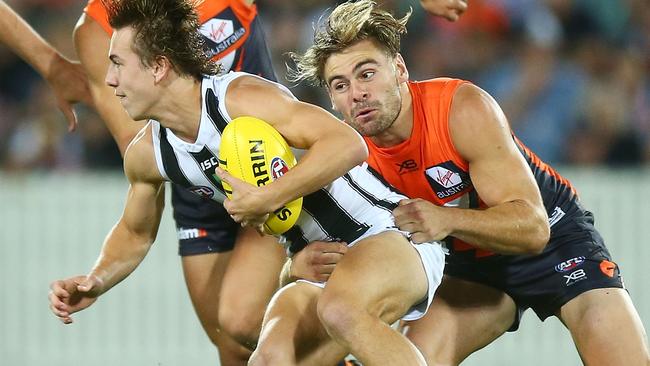 Stephen Coniglio nabs Magpie Callum Brown.