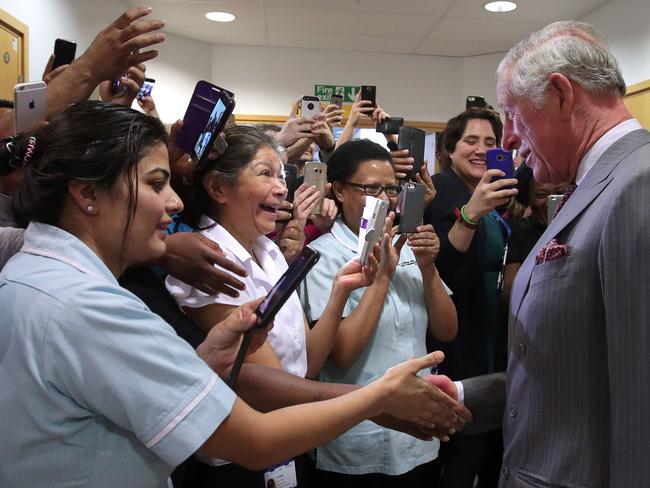 Prince Charles of Wales, meets nursing staff after meeting with paramedics and support staff who assisted those injured. Picture: AFP