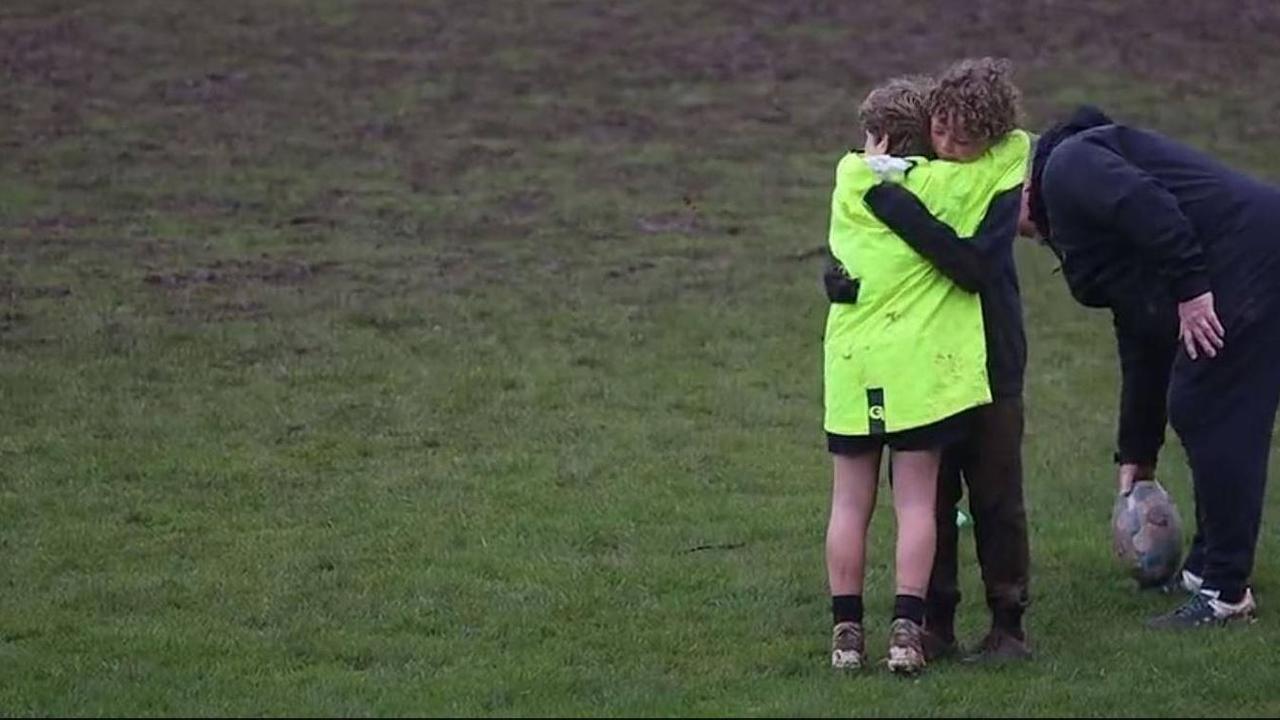 A young rugby player (left) has been praised for his beautiful pep talk to a teammate (right) who was overcome by the challenge of tackling bigger boys. Picture: Sedbergh School