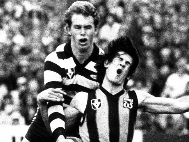 Wallace, tackled by Cat Terry Bright, in his first season of VFL footy.