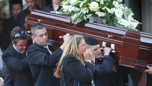 Wendy Peirce weeps as her daughter’s coffin is carried out.