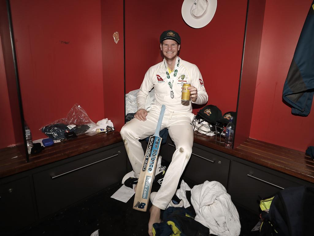 Steve Smith celebrates in the changerooms after Australia retained the Ashes.