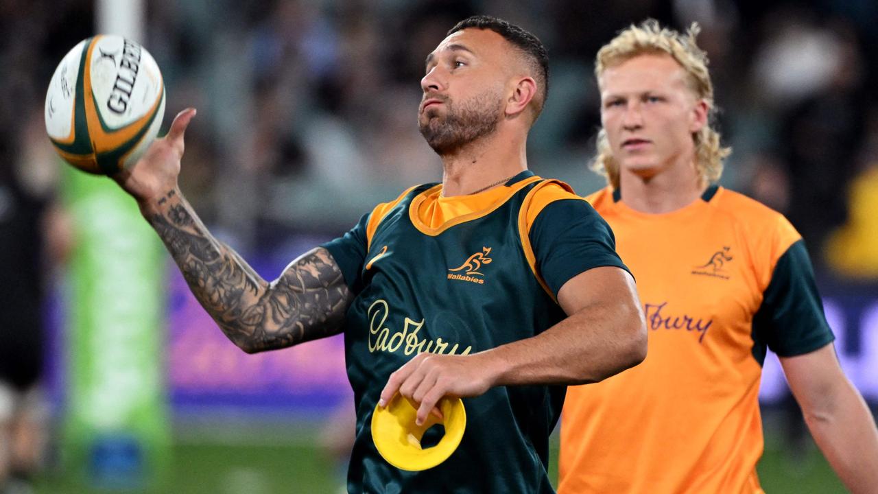 Quade Cooper (L) and Carter Gordon (R). (Photo by William WEST / AFP)