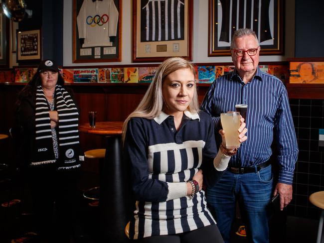 Shannon Burton wearing her dadÃ¢â¬â¢s (Rod Burton ) gurnsey, Alberton Hotel Director Peter Brien and Jo Curyer from the Port Adelaide Cheer Squad at the Alberton Hotel on April 29, 2021, after hearing the news that Port can't wear the traditional prison bar jumper at the Showdown. Picture Matt Turner.