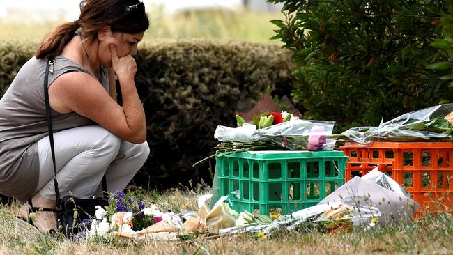 A woman visits the site of tributes for Aiia Maasarwe. Picture: Nicole Garmston