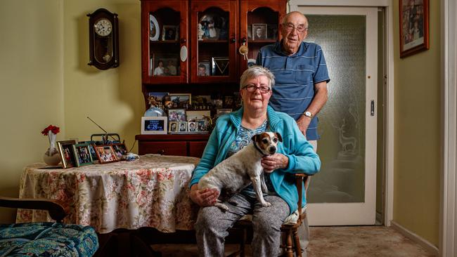 David and Gillian Atkinson with their dog Spot in their Morphett Vale. Picture: Matt Turner