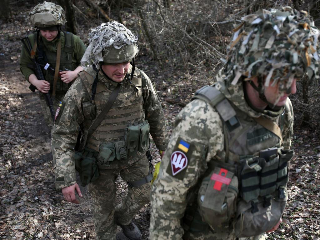 Ukrainian servicemen are seen at a position on the front line with Russia-backed separatists near the town of Schastia, near the eastern Ukraine city of Lugansk. Picture: AFP