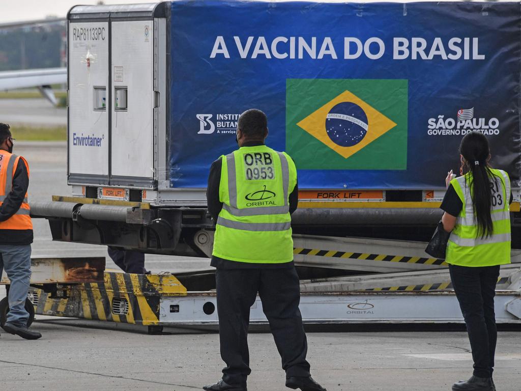 A container carrying doses of the CoronaVac vaccine is unloaded from a cargo plane at the Guarulhos International Airport, in Sao Paulo, Brazil. Picture: AFP