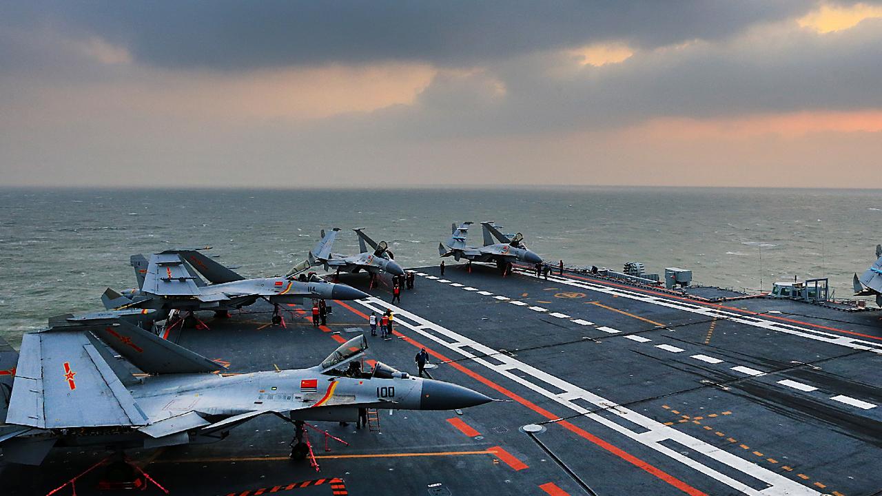 The undated photo shows Chinese aircraft carrier Liaoning carrying J-15 fighter. J-15 fighter jets have recently conducted flight training on the carrier. Liaoning, a refitted Soviet Union-made carrier, was put into commission by the Chinese People's Liberation Army (PLA) Navy in 2012. Picture: PLAN