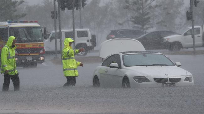 A car is flooded on Queens St in Southport after a storm lashes the Gold Coast.Photograph : Jason O'Brien