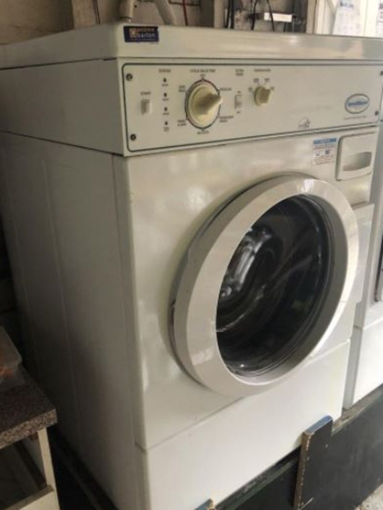 A commercial front-loader washing machine is listed at $1.