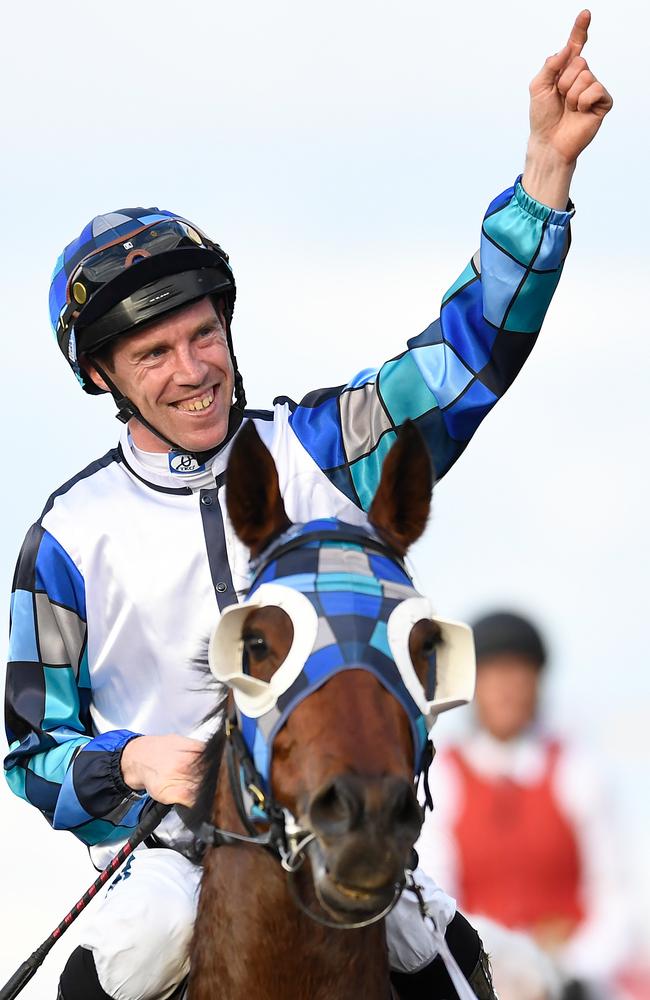 John Allen gestures after riding Kenedna to victory.