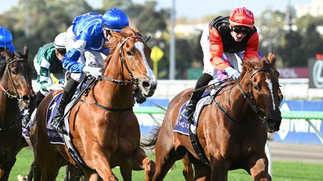 Miss Ole (blue) arrives in time to defeat Espana at Flemington on Saturday. Picture: Getty Images