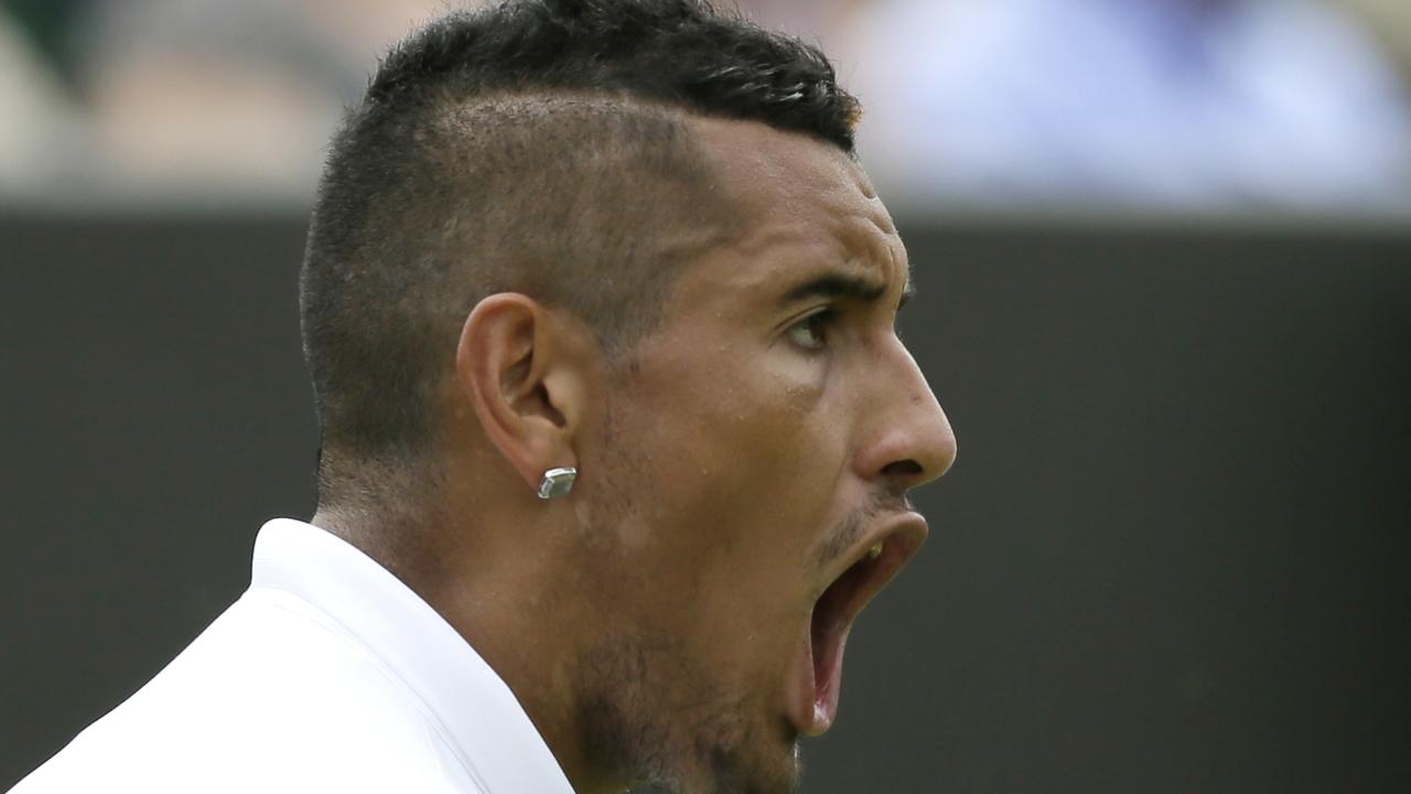 Nick Kyrgios of Australia celebrates after winning a point against Diego Schwartzman of Argentina during the men's singles first round match at the All England Lawn Tennis Championships in Wimbledon, London, Monday June 29, 2015. (AP Photo/Tim Ireland)