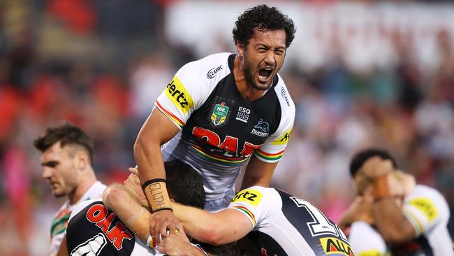 SYDNEY, AUSTRALIA — MARCH 17: Corey Harawira-Naera of the Panthers jumps on his team mates as they celebrate Tyrone Peachey of the Panthers scoring a try during the round two NRL match between the Penrith Panthers and the South Sydney Rabbitohs at Penrith Stadium on March 17, 2018 in Sydney, Australia. (Photo by Mark Kolbe/Getty Images)