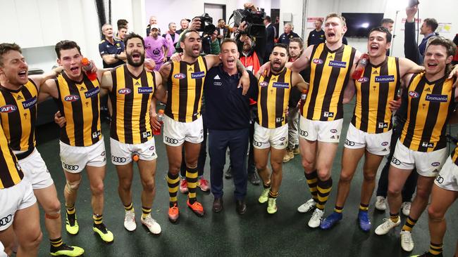 Alastair Clarkson celebrates the win over Sydney with his players.